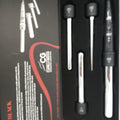 Professional 4P curling iron with sleek black housing and polished silver metallic barrels.