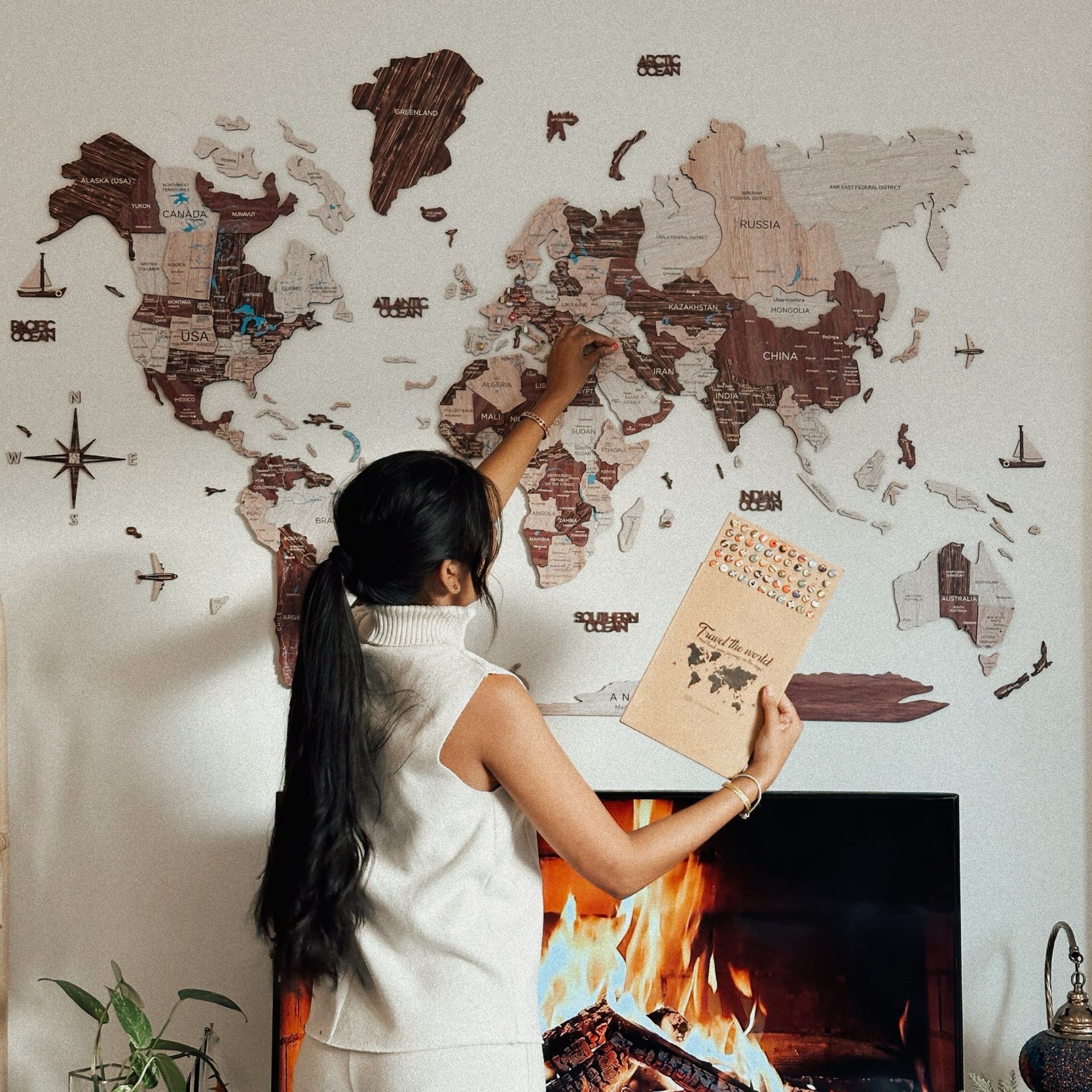 3D Wooden World Map in Cappuccino finish mounted on a modern living room wall