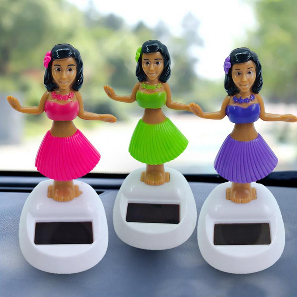 Solar powered dancing hula girl car dashboard ornament in a tropical outfit