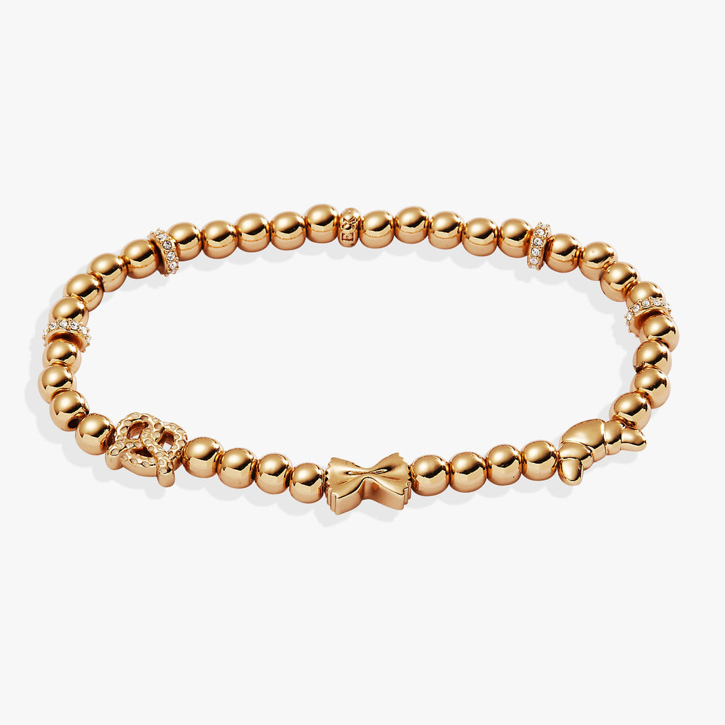Gold-tone beaded stretch bracelet with pretzel, croissant, and pasta charms