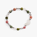 Silver-tone stretch bracelet with earth-tone gemstones and a white quartz crescent moon charm