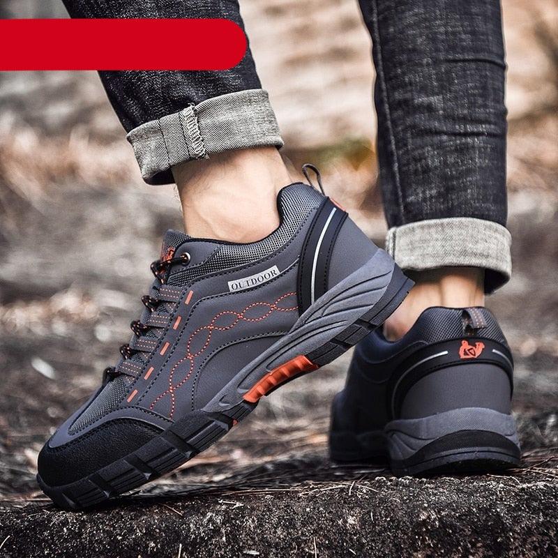 Men's leather low cut outdoor walking shoes in grey and orange colorways