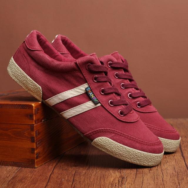 Men's SHANBU canvas lace-up sneakers in burgundy, olive green, and beige for casual walking.