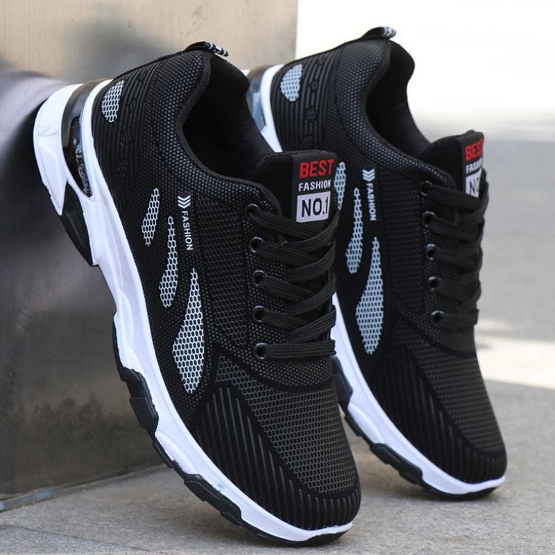 Men's mesh athletic running sneakers in black, red, and white