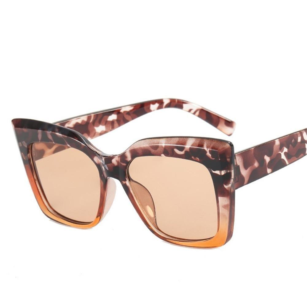 Trendy oversized square cat eye sunglasses with thick frames.