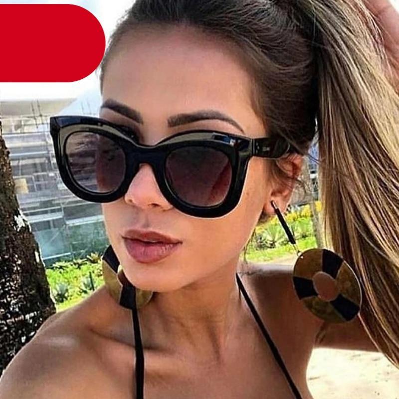 Woman wearing stylish oversized vintage cat eye sunglasses in black