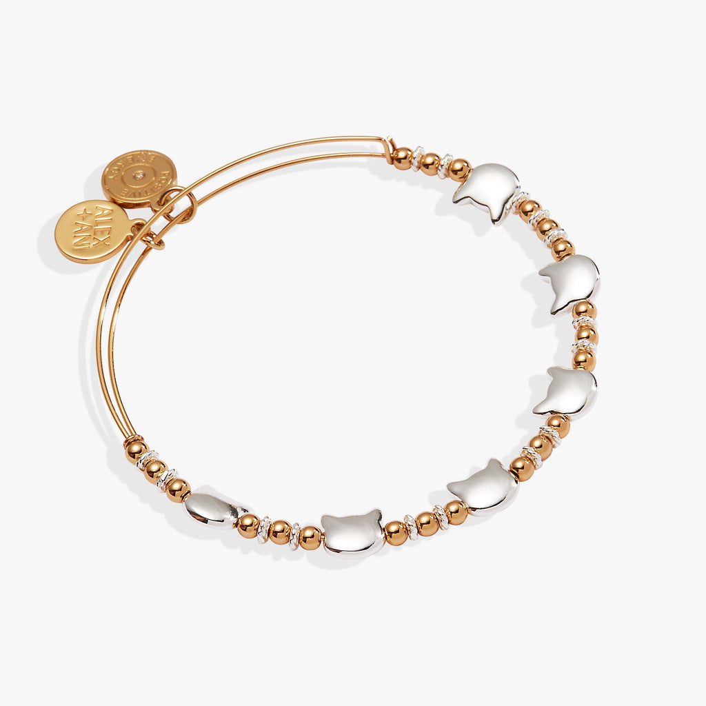 Two-tone expandable wire bangle featuring cat-head silhouettes and decorative accent beads.