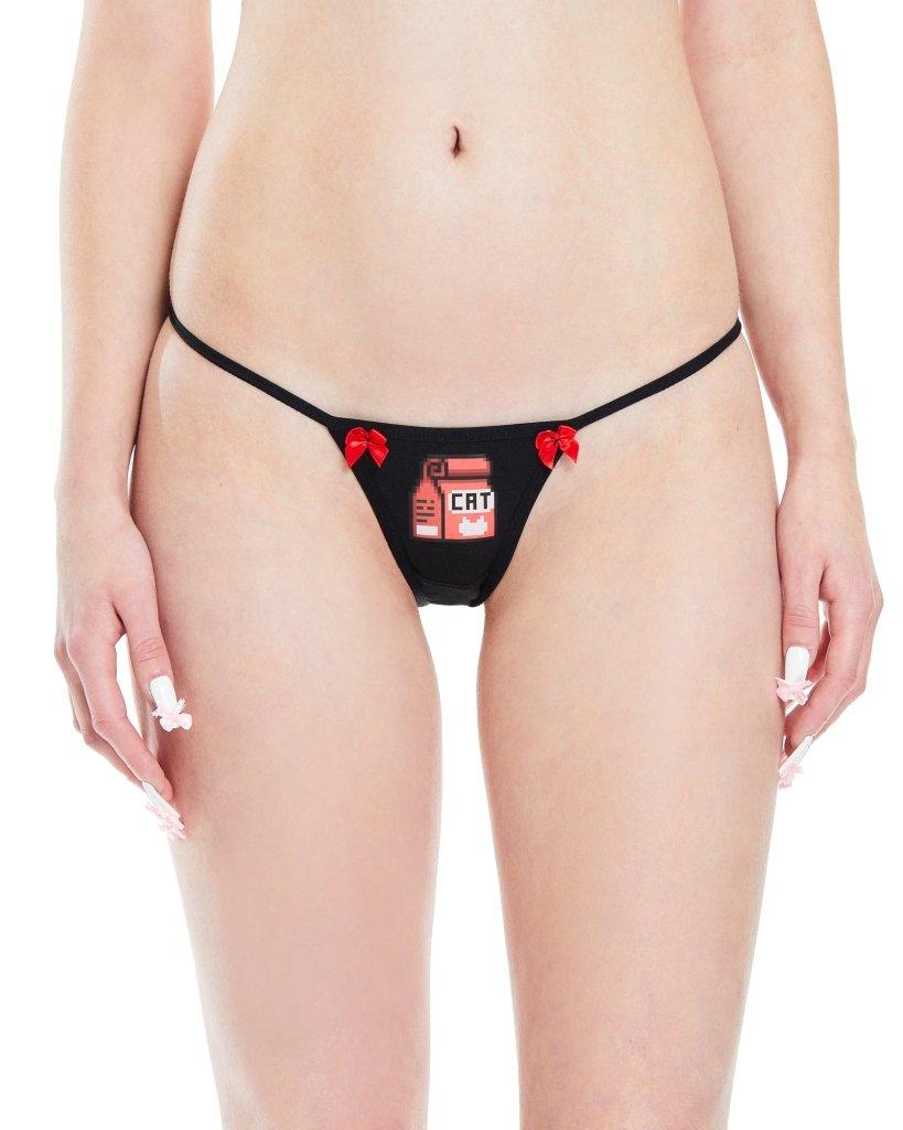 Close up of a black g-string with pixelated kitten graphic and vibrant red bows