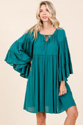 A feminine and sophisticated dress by Stevvex featuring frill details and bell sleeves.