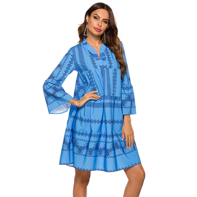 Bohemian-style mid-length dress featuring a blue geometric digital print and flare sleeves.