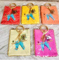 Set of 5 multicolored gift bags featuring traditional Bansuri and Mor Pankh peacock feather prints.