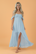 Light blue off-shoulder maxi dress with a ruched bust and elegant side slit.