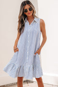 Woman wearing a sleeveless, collared blue and white striped A-line mini dress with a ruffle hem.