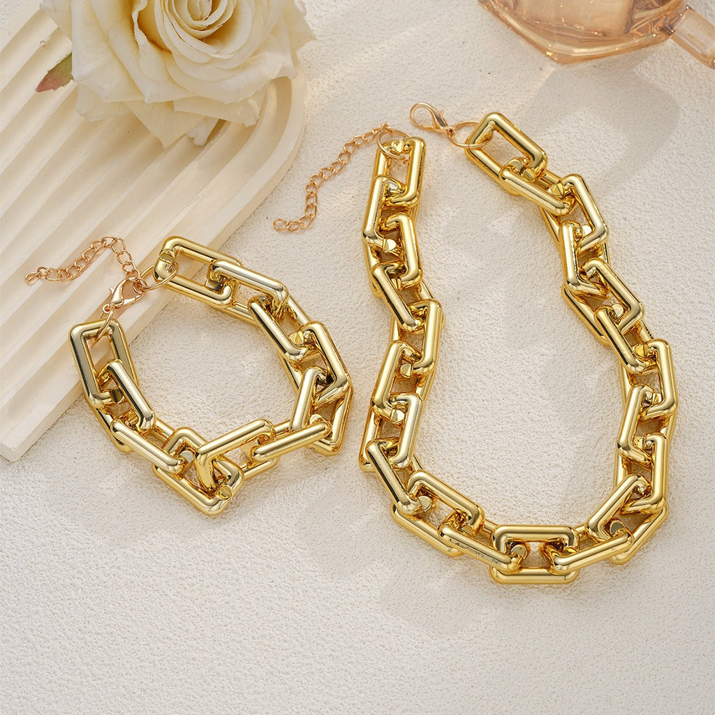 Matching geometric chunky rectangular chain necklace and bracelet set in gold.