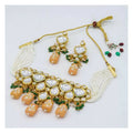 Traditional Kundan necklace set with gold, white, peach, and green stones