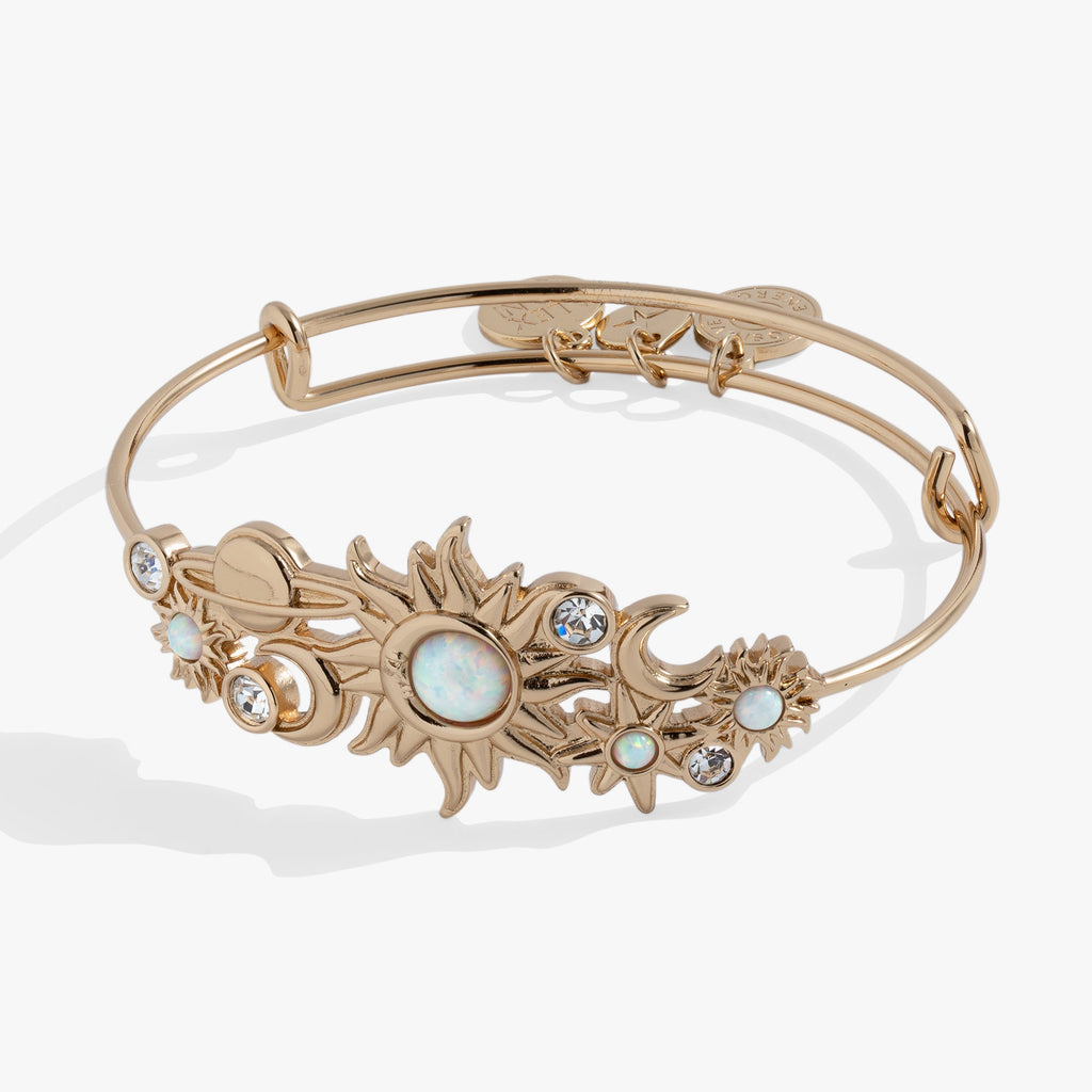 Celestial In-Line Bangle featuring sun, moon, and star charms with blue opal gemstones.