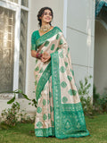 Cream and sea green silk blend saree with a traditional finish.