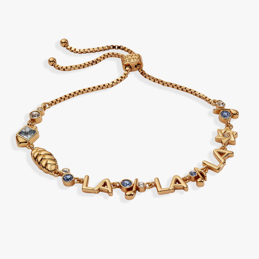 Festive bolo bracelet featuring a challah bread charm, musical notes, and aquamarine crystal accents.