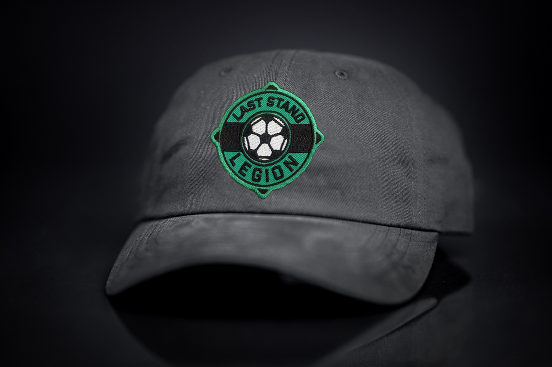 A relaxed-fit dad hat featuring a soccer ball graphic, perfect for soccer fans.