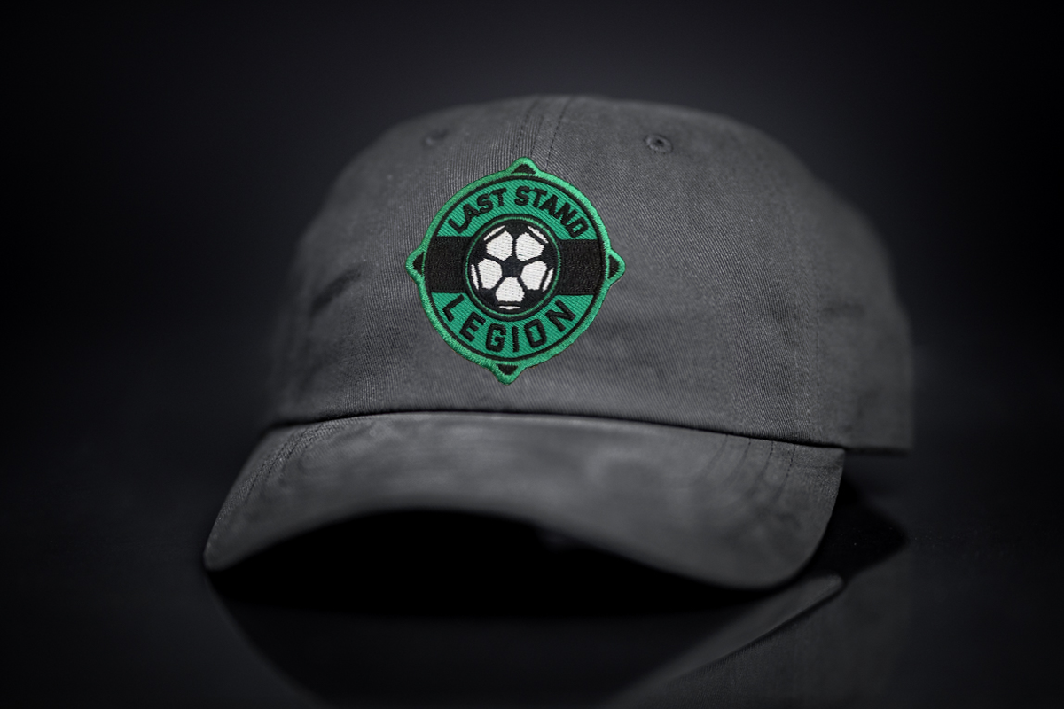A relaxed-fit dad hat featuring a soccer ball graphic, perfect for soccer fans.