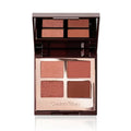 Charlotte Tilbury Luxury Palette in The Vintage Vamp featuring four purple-red eyeshadow shades.