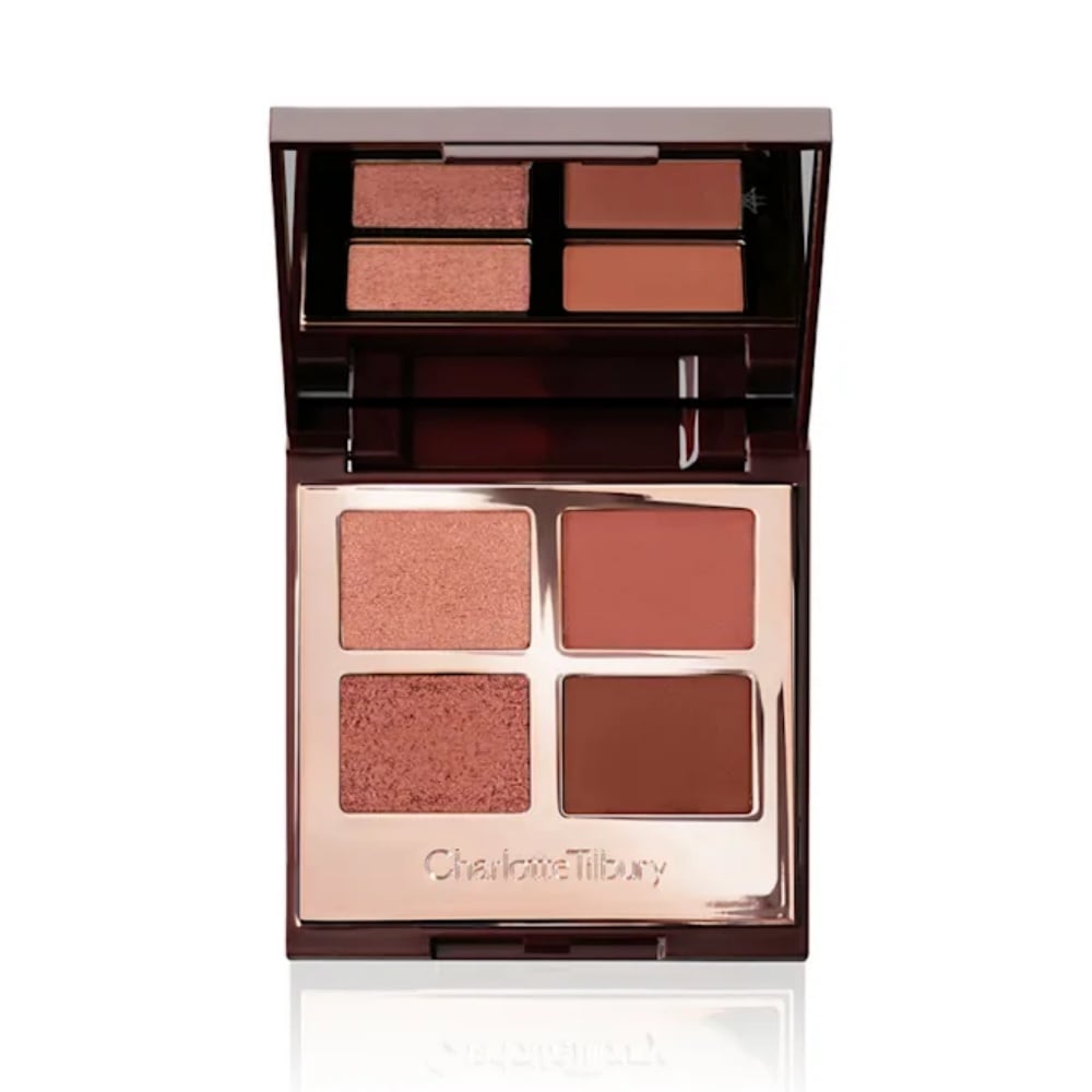 Charlotte Tilbury Luxury Palette in The Vintage Vamp featuring four purple-red eyeshadow shades.