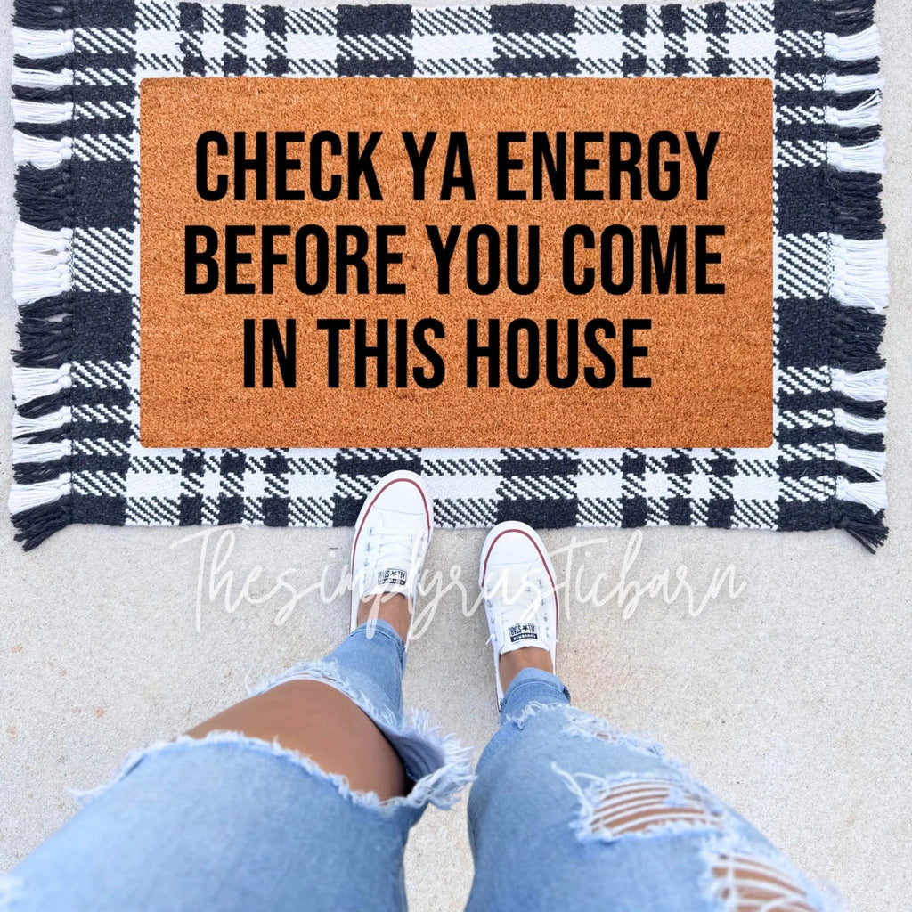 Check Ya Energy Before You Come In This House doormat in brown, black, and white
