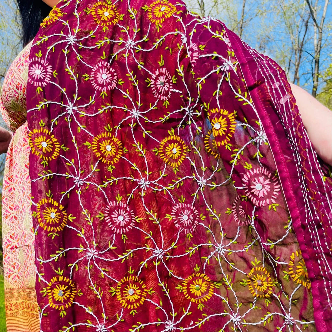 Close up of a Chiffon Phulkari scarf featuring intricate traditional embroidery and lightweight fabric texture.