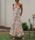 Sleeveless orange floral chiffon maxi dress with V-neck and tie waist in a bohemian style