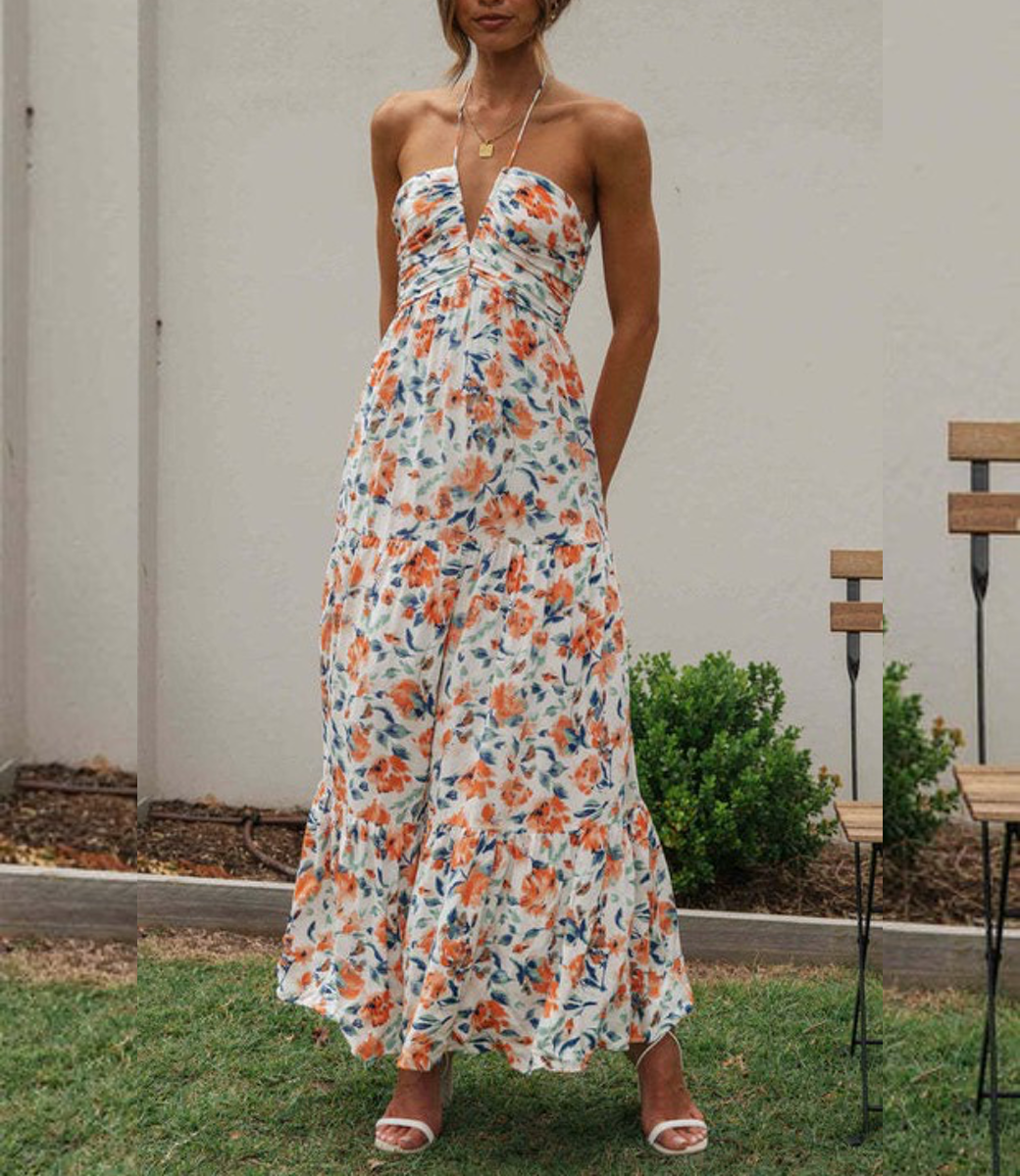 Sleeveless orange floral chiffon maxi dress with V-neck and tie waist in a bohemian style