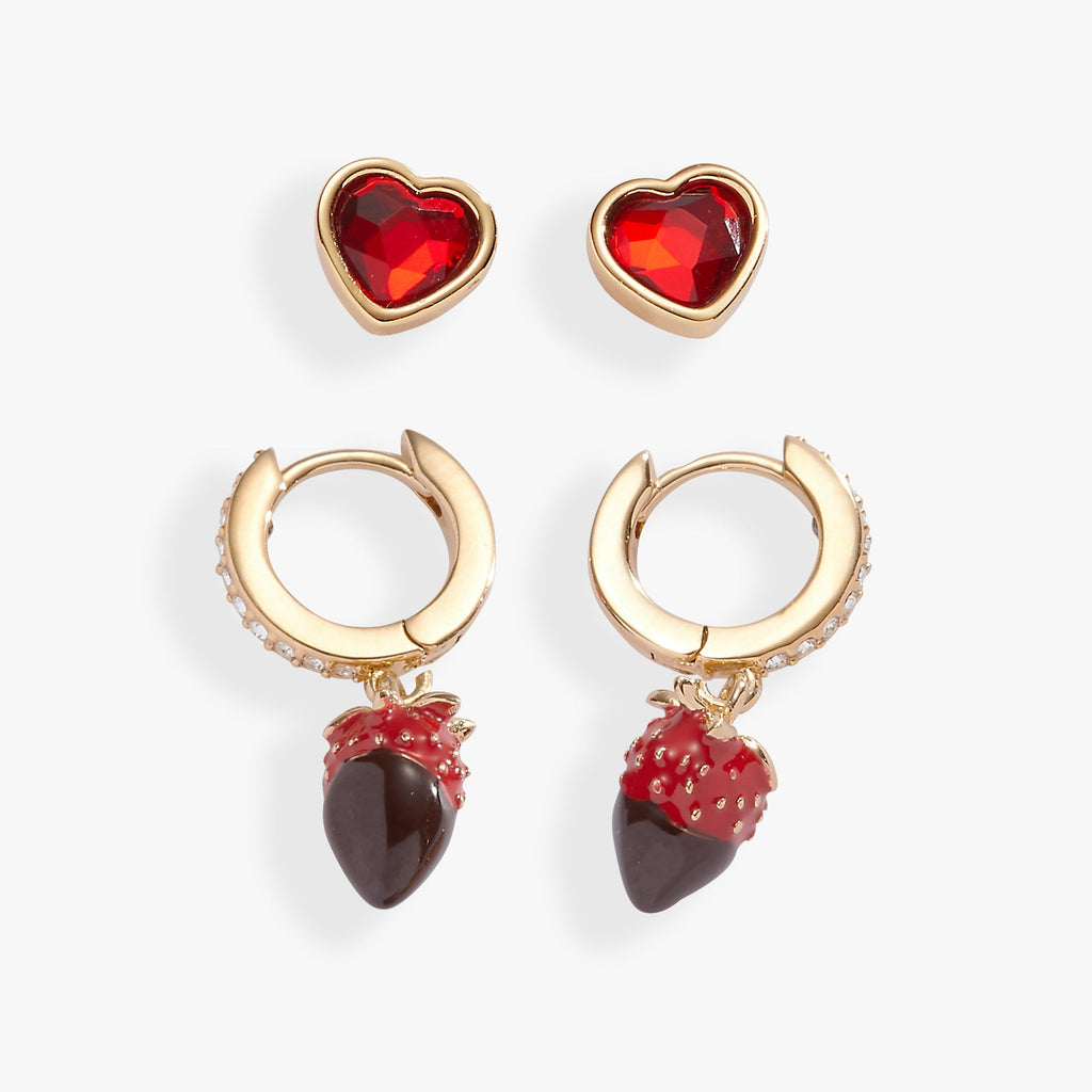 Set of two pairs of earrings featuring chocolate box posts and crystal-embellished chocolate strawberry huggie hoops.