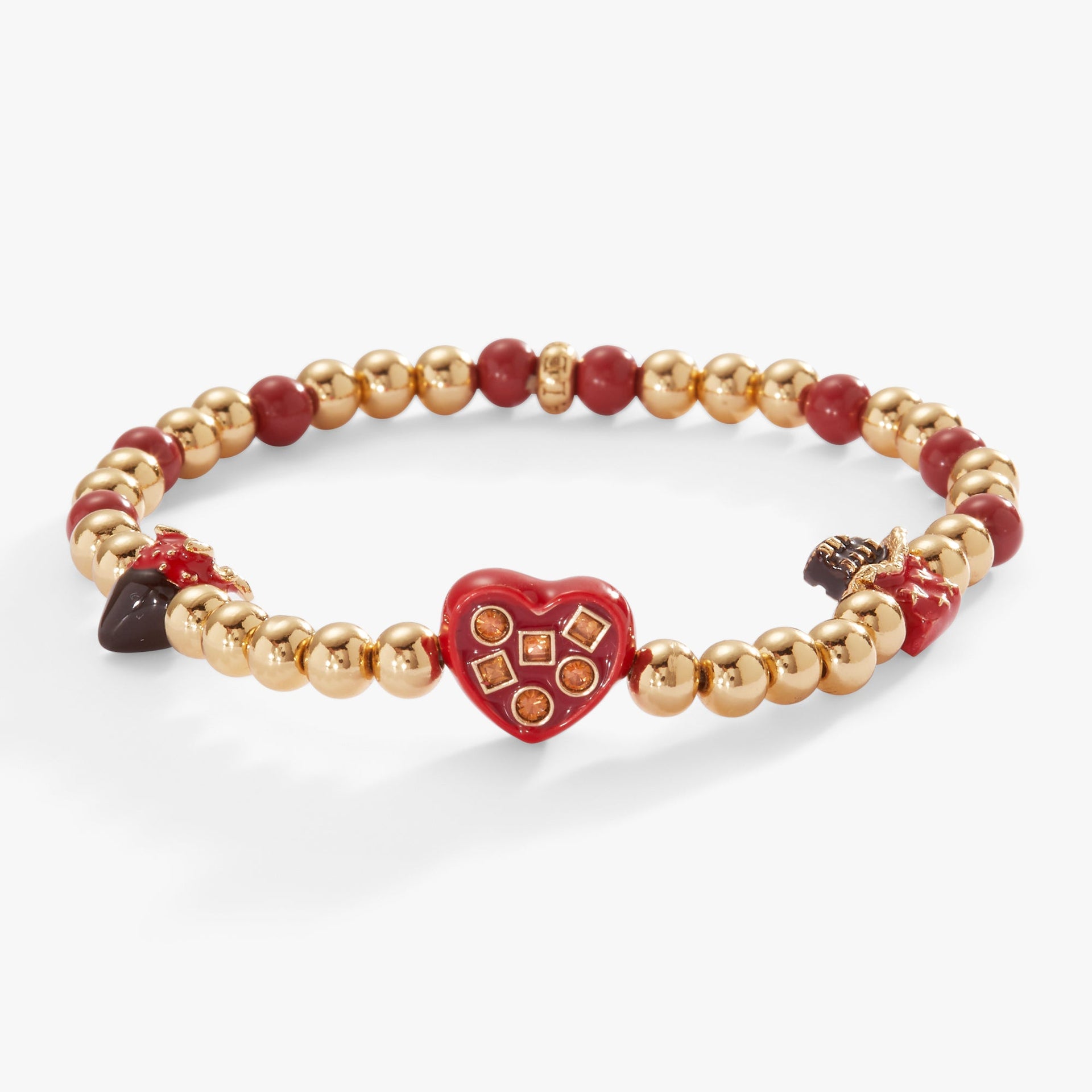 Gold-tone stretch charm bracelet featuring chocolate-themed charms including a strawberry and chocolate bar.