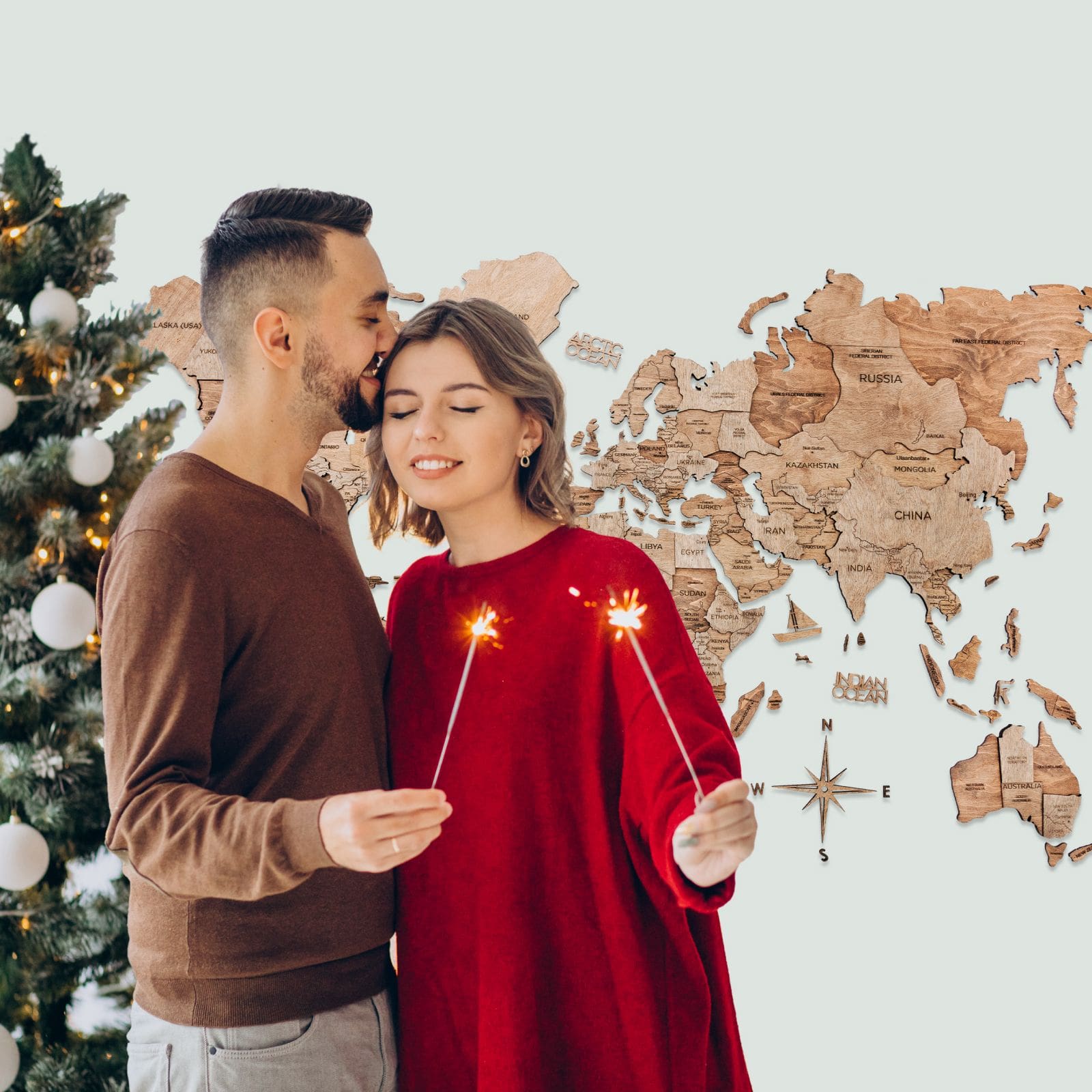 Natural wood Terra travel map decorated for the Christmas season on a wall