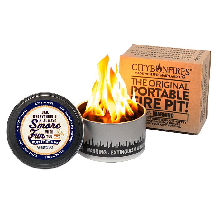 Father's Day Edition portable mini fire pit in silver and black on a patio table.