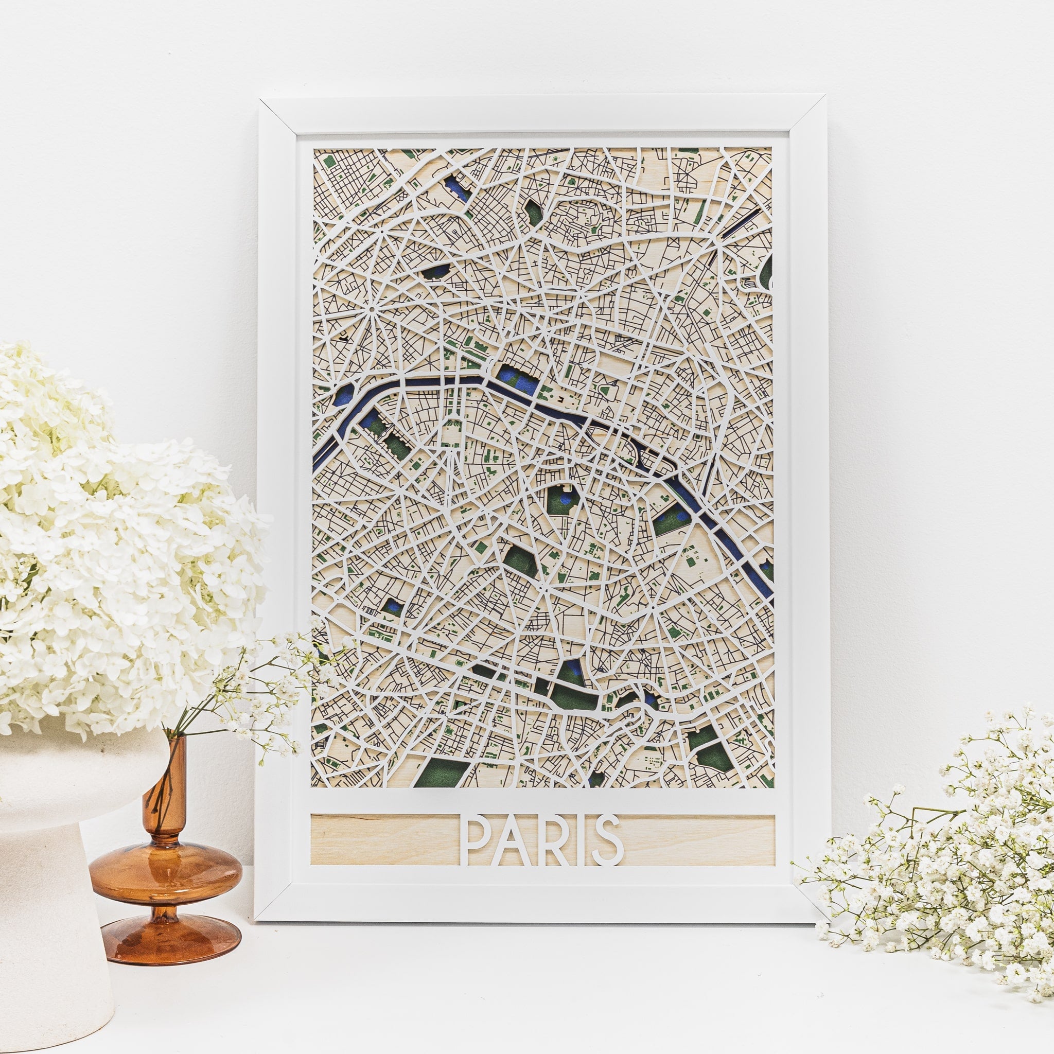 Handcrafted 3D wooden map of Paris showing detailed streets and riverbanks