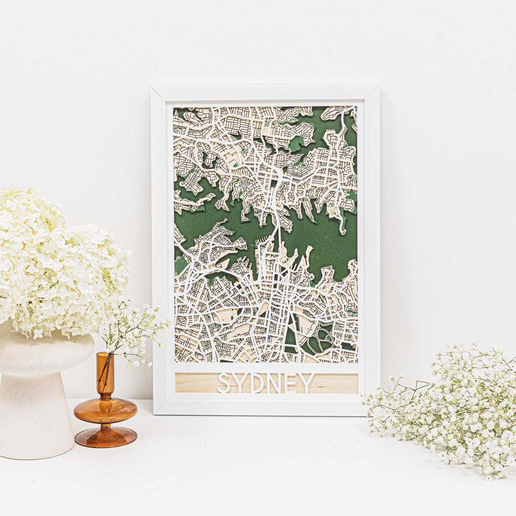 3D Sydney city map made of wood with green and white details on a minimalist wall