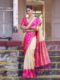 Cream soft silk saree paired with a contrasting pink blouse piece