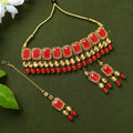 Gold-polished Kundan and pearl choker with red accents