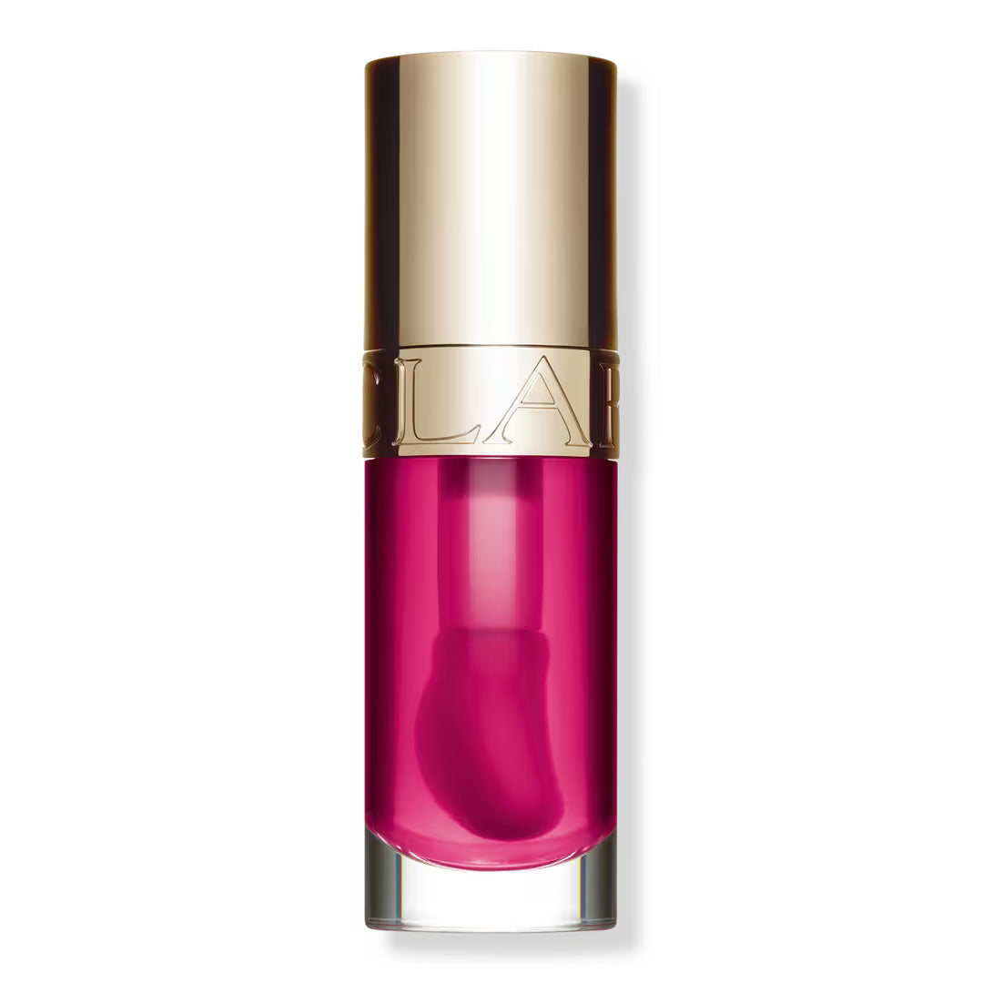 Clarins Lip Comfort Oil in Raspberry shade, showing a glossy, sheer red lip oil applicator.