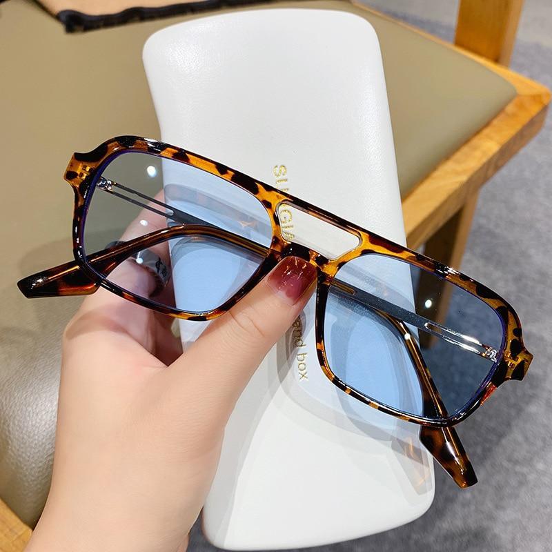 Retro-style square sunglasses with pink gradient lenses and double bridge design