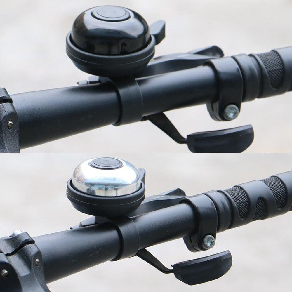 Classic metal bicycle bell on a child's bike handle
