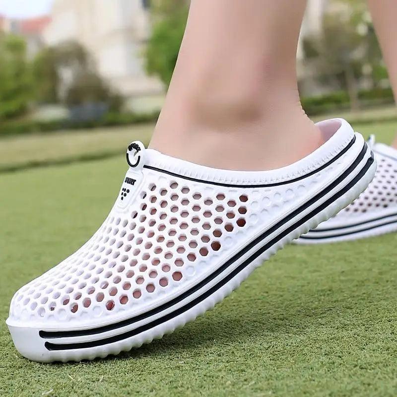 Unisex hollow-out garden clogs in solid colors for casual wear.