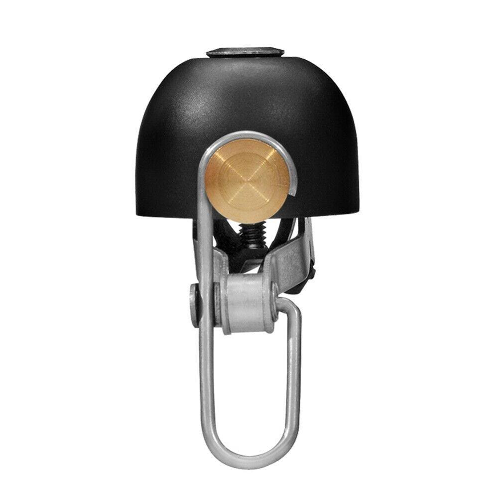 Minimalist stainless steel ring on a neutral background, capturing its polished, elegant design.