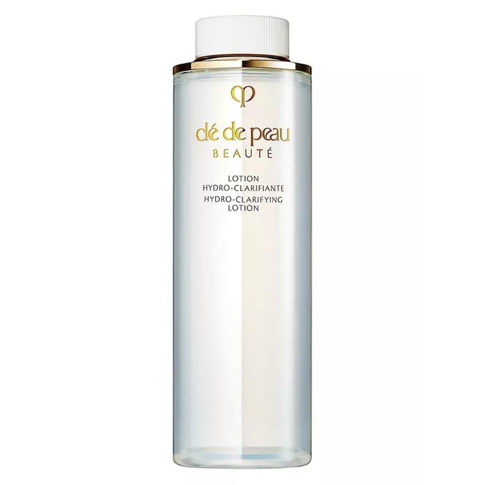 Clé de Peau Beauté Hydro-Clarifying Lotion in a clear and gold bottle