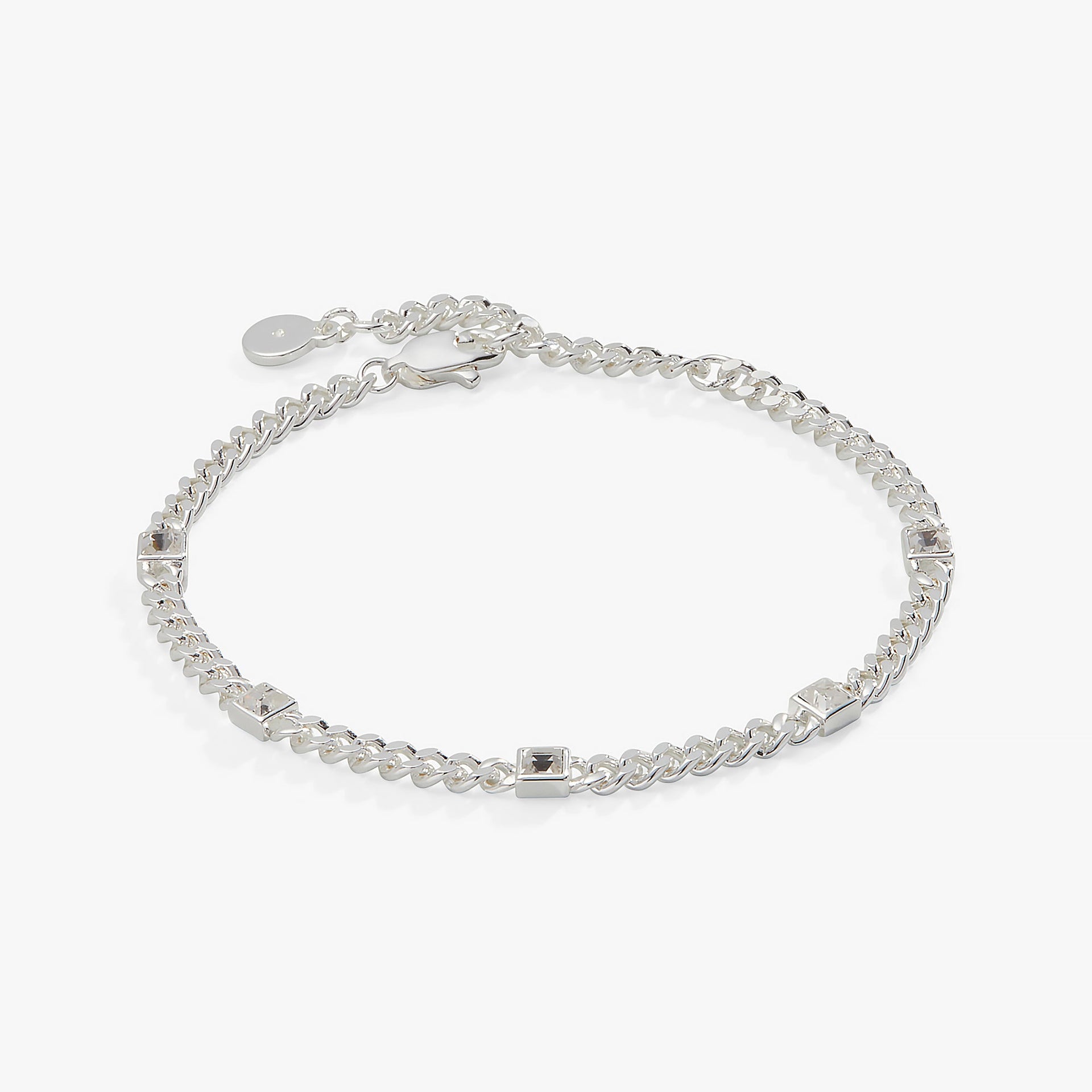 April birthstone bracelet featuring bezel-set clear crystals on a stainless steel curb chain