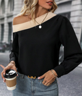 Front view of a black color blocked off-shoulder blouse made of smooth polyester fabric.