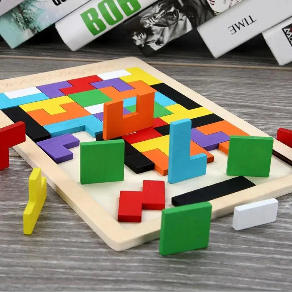 Colorful geometric wooden tangram puzzle game on a child's playroom table