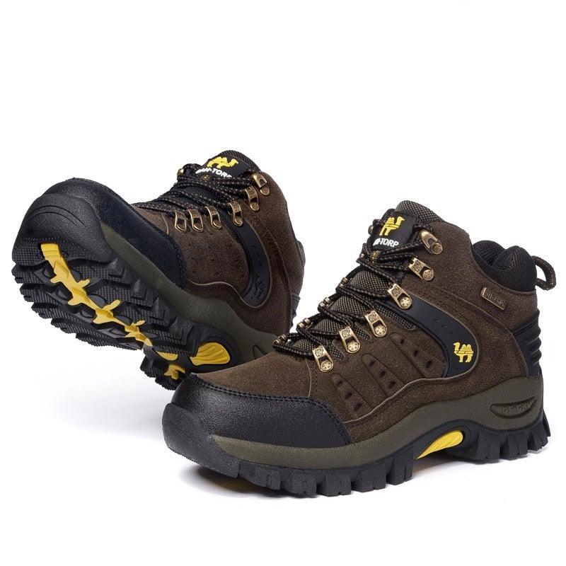 A pair of rugged brown leather waterproof men's hiking boots with high-contrast soles and lace-up closure.