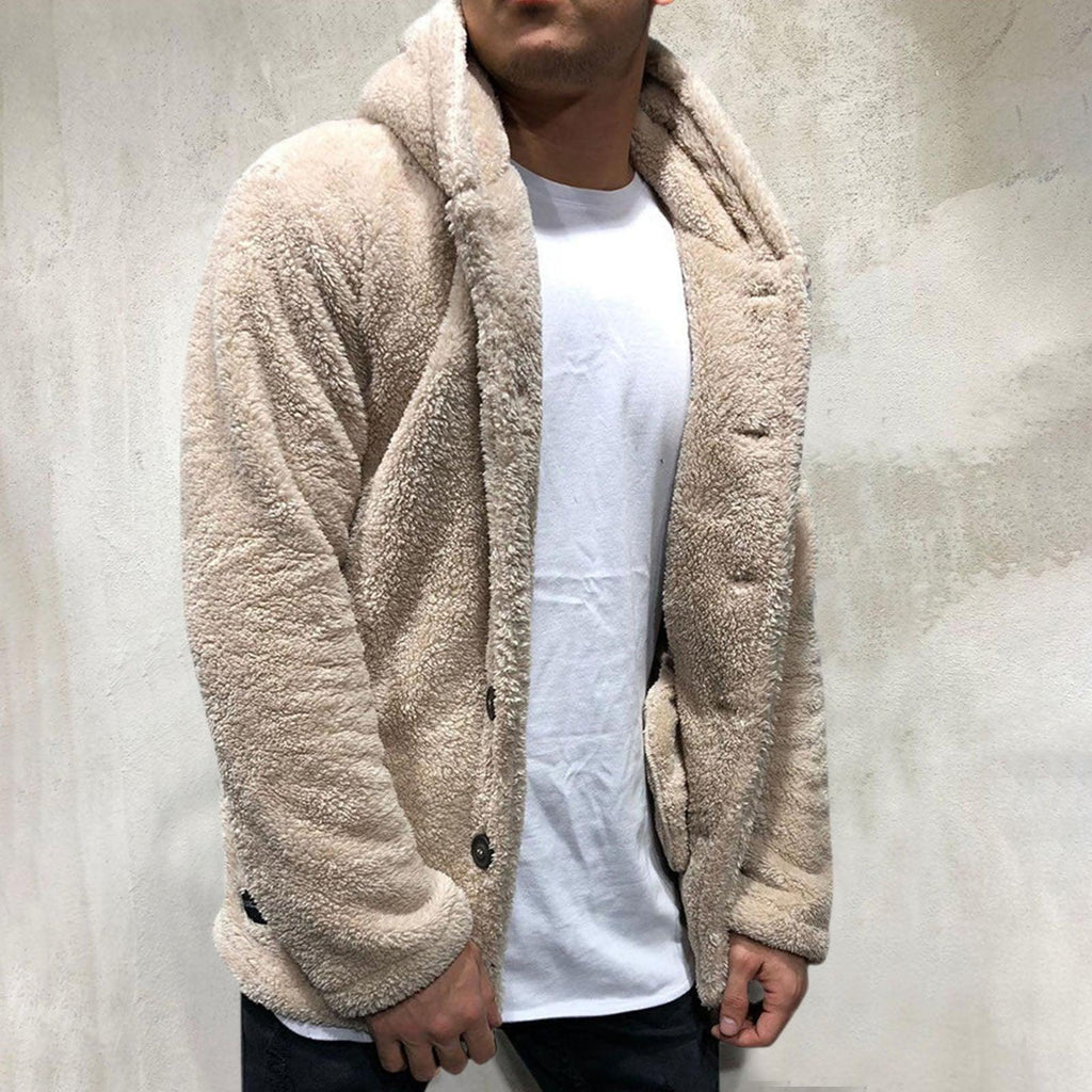 Model wearing a thick, plush hooded unisex winter jacket in solid beige.