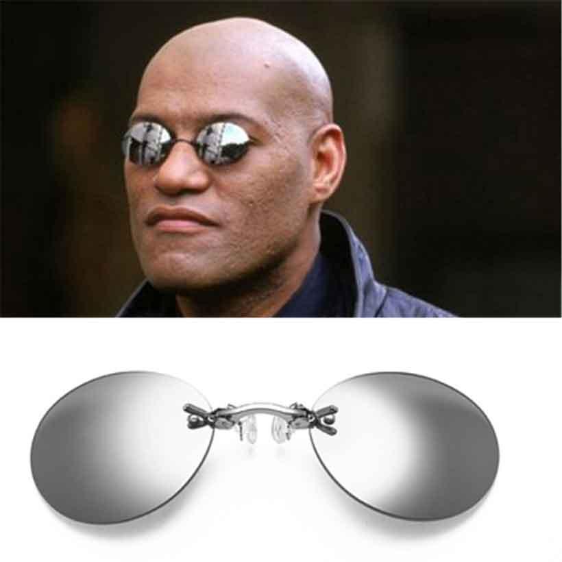 Vintage round rimless clip-on sunglasses in silver with gray lenses.